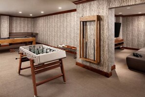 A room with a foosball table, a pool table, and a television. - Ritz-Carlton Vail Luxury 3BR/3.5 BA+Full Kitchen. Direct Access to Slope (Vail)