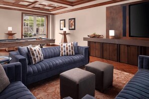 A living room with a pool table, a sofa, ottomans, and a bar area. - Ritz-Carlton Vail Luxury 3BR/3.5 BA+Full Kitchen. Direct Access to Slope (Vail)