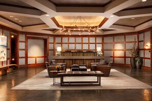 A lobby with a reception desk, seating area, and a large chandelier. - Ritz-Carlton Vail Luxury 3BR/3.5 BA+Full Kitchen. Direct Access to Slope (Vail)
