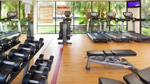 A gym with treadmills, dumbbells, and weight machines. - Beautiful 2 BR condo in Orlando minutes from all attractions. (Orlando)