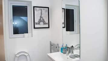 Shower, deep soaking tub, towels