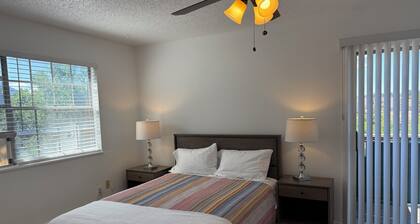 Peaceful creek side 2-bedroom condo with AC and private patio