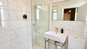 Hair dryer, towels, soap, shampoo