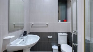 A modern bathroom with a sink, toilet, and shower. - Belmonte Heights Flat 2BDR (Sliema)