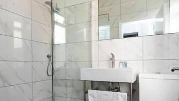 Hair dryer, towels, soap, shampoo