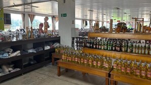 A store interior with shelves stocked with various items, including bottles and boxes.