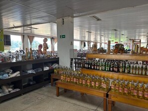 A store interior with shelves stocked with various items, including bottles and boxes.