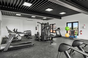 A gym with treadmills, weight machines, and exercise balls. - 5-Min Drive to Eagle Beach|Large Patio|Pool&Jacuzzi (Noord)