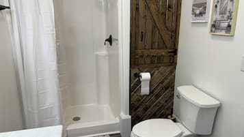 Shower, jetted bath, towels, soap