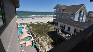 A beachfront property with a swimming pool, beach access, and ocean views. - Maritime Place B9 - Oceanfront in Garden City Beach (Garden City)