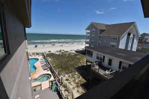 A beachfront property with a swimming pool, beach access, and ocean views. - Maritime Place B9 - Oceanfront in Garden City Beach (Garden City)