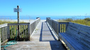 A wooden boardwalk leading to a beach with a sign indicating a shower for South Pointe residents only. - South Pointe Villas 6 - Oceanfront Complex (Oceanview Unit) in Garden City Beach (Garden City)