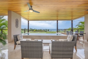 A covered outdoor seating area with a view of the ocean. - Condo Aries 3BD - Marietas Punta Mita (Punta de Mita)
