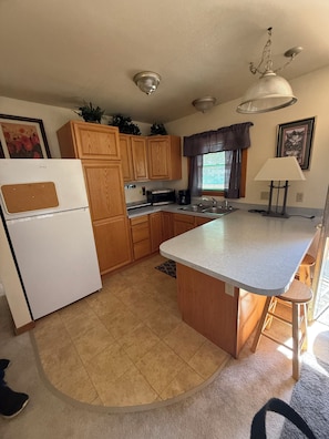Fridge, microwave, toaster, cookware/dishes/utensils
