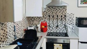 A compact kitchen with a microwave, toaster, and a small oven. - #43 Digbeth Private Studio Apart (West Midlands)