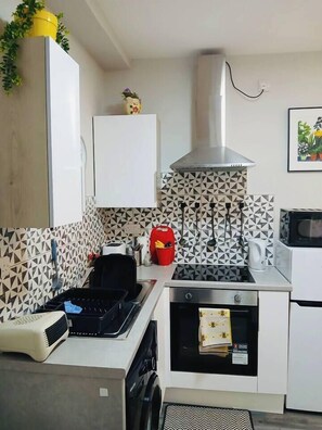 A compact kitchen with a microwave, toaster, and a small oven. - #43 Digbeth Private Studio Apart (West Midlands)