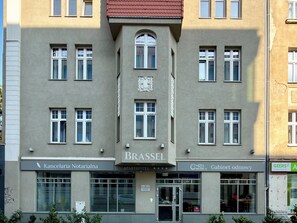 A building with multiple windows and a central entrance.