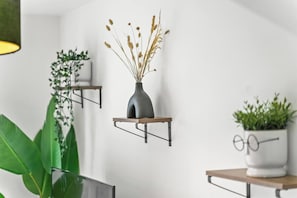 A modern interior with three wall-mounted shelves, each holding a plant. - #28 Luxury 5bdr house|sleeps 11|near Bullring (West Midlands)
