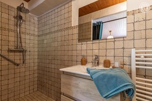 A bathroom with a shower, a sink, and a mirror. - The Bisanne Mill: The Beaufortain Balcony (VILLARD SUR DORON)