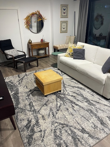 Spacious private bedroom with ensuite and living room with separate entrance