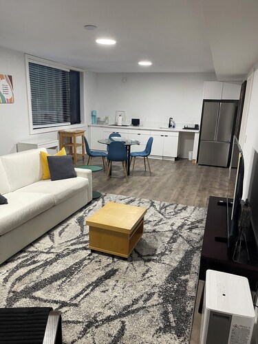 Spacious private bedroom with ensuite and living room with separate entrance