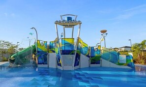 A water park with a central structure featuring slides and a pool. - Sleeps 12 - 4 Kings, Private Heated Pool & Resort Fun (Davenport)