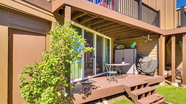 A covered patio area with a table and chairs, a barbecue grill, and a small garden with a potted plant. - Renovated Tahoe Keys Getaway Near Lake & Heavenly (South Lake Tahoe)