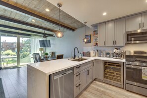 A modern kitchen with stainless steel appliances, a dishwasher, and a wine cooler. - Renovated Tahoe Keys Getaway Near Lake & Heavenly (South Lake Tahoe)