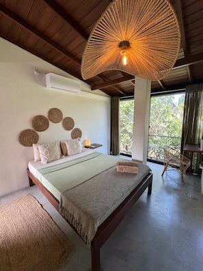 ห้องดีลักซ์ดับเบิลหรือทวิน, วิวสวน | โต๊ะทำงาน, พื้นที่ทำงานแบบใช้แล็ปท็อป, Wi-Fi ฟรี, ผ้าปูที่นอน