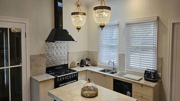 Coffee/tea maker, fridge, microwave, oven