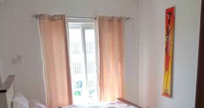 Playful 2-bedroom apartment in vibrant Fumbatown with AC, hot water and internet