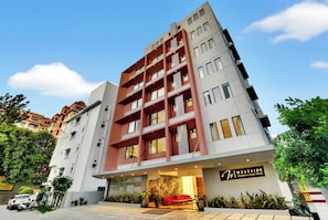 A multi-story hotel with a modern facade, a visible entrance with a reception area, and a sign indicating the name 'Westside Studios & Apart Hotel'. - Westside Studio & Apart Hotel (Hyderabad)