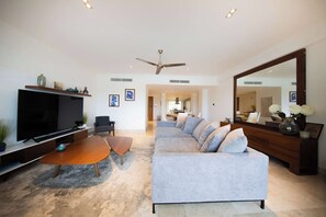 Comfortable living room with TV and ceiling fan