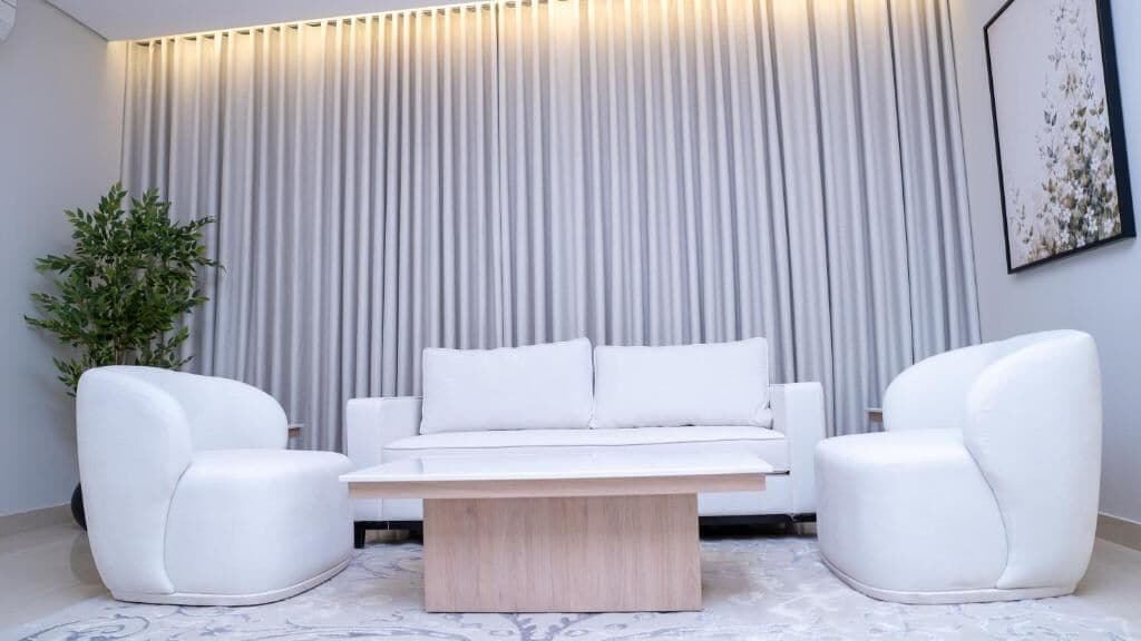 Departamento Deluxe, 1 habitación, vista a la ciudad | Área de sala de estar