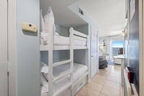 A bunk bed room with a view of the sea through a window. - Royal Palms 1008 by Liquid Life (Gulf Shores)