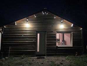 A wooden cabin with a sloped roof, a front door, and a window. - Forest Cabin on 11 Hectares (Le Bosc du Theil)