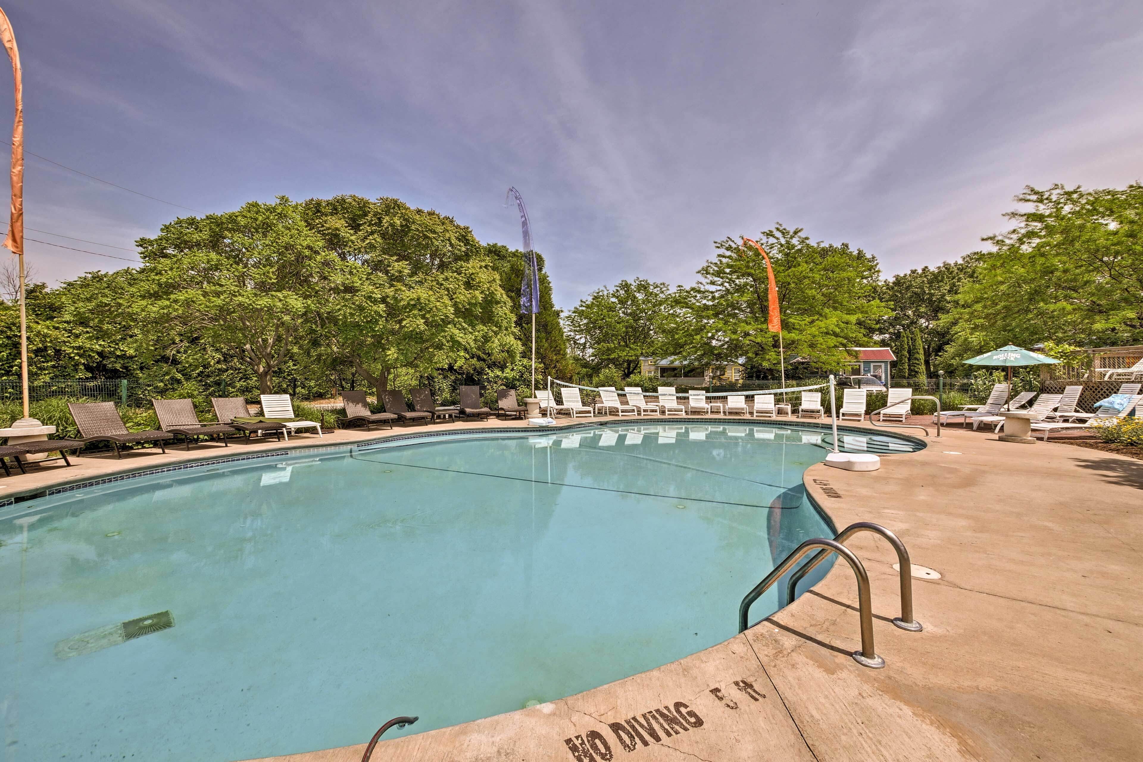 A swimming pool with lounge chairs and a 'No Diving' sign.