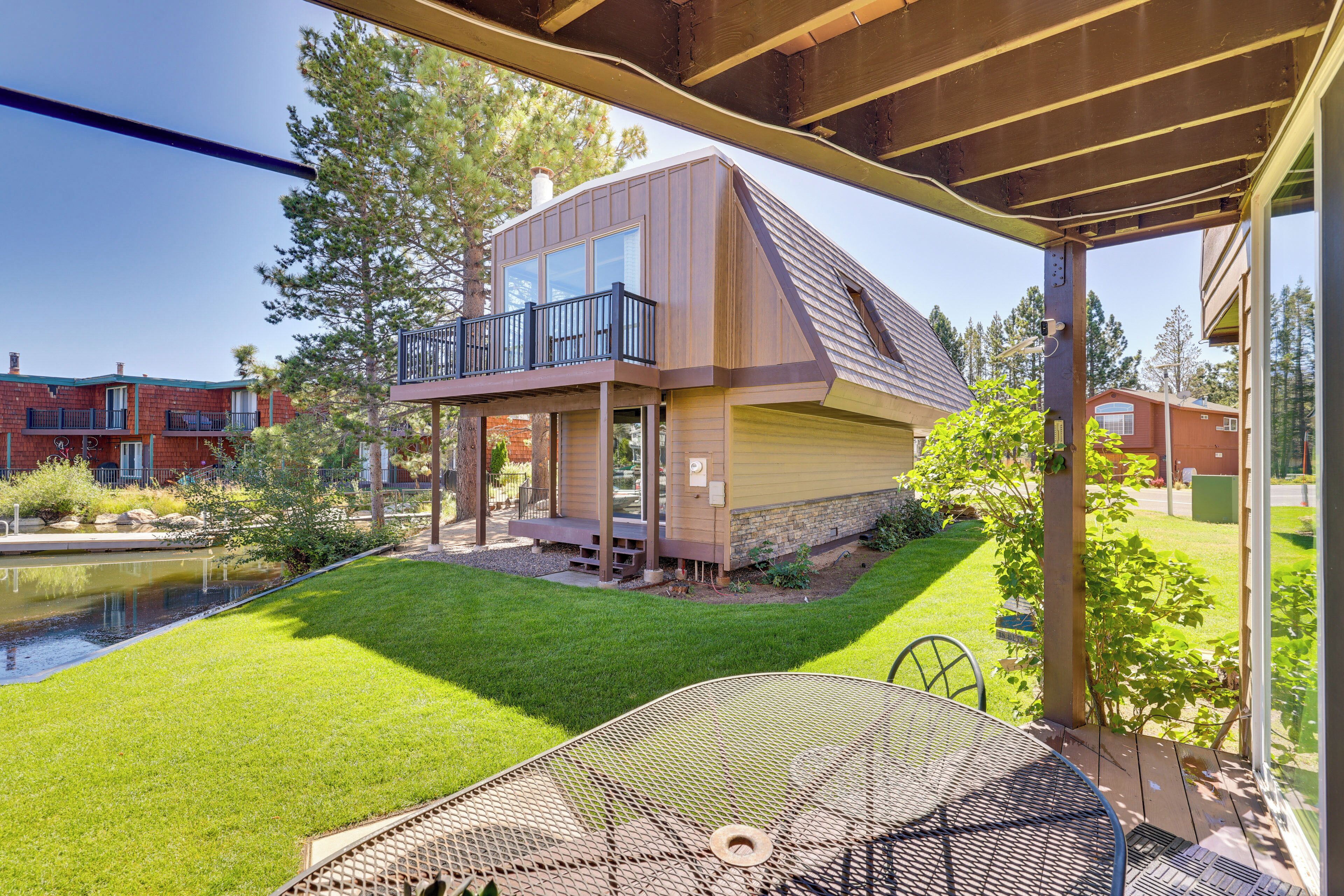 A two-story house with a covered patio area.