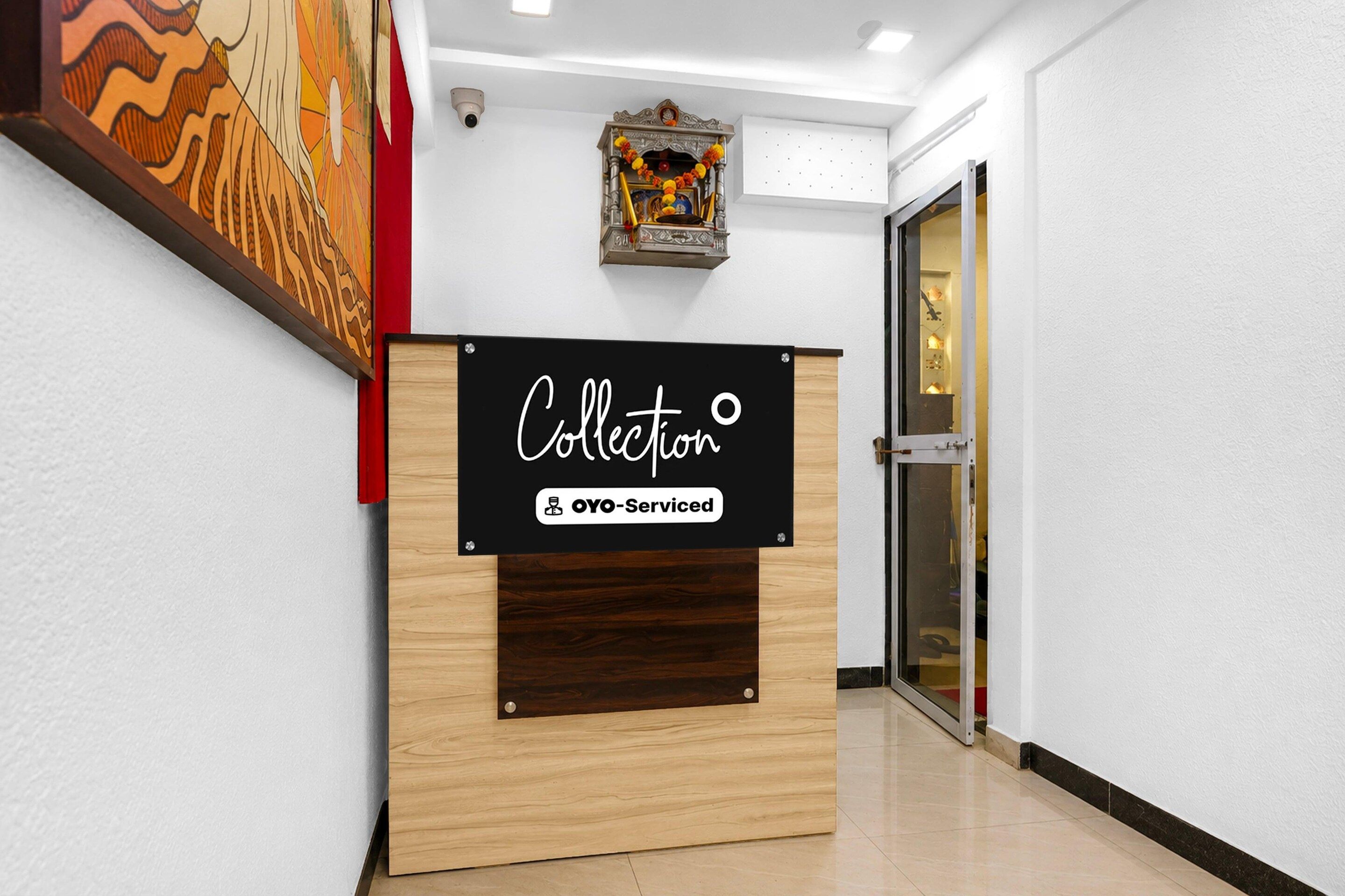 A reception desk with a sign that reads 'Collection' and 'YO-Serviced'.
