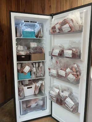 A refrigerator with multiple shelves containing various packaged food items. - Weber Hill Farm Cabin in Bovina! Operating Dairy Farm visits available with stay (Bovina Center)