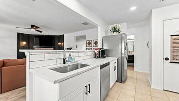 Coffee/tea maker, fridge, microwave, oven