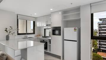Comfort Apartment, Balcony | Private kitchen | Oven, stovetop, cookware/dishes/utensils