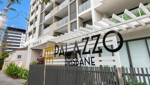 A modern building with balconies and a sign that reads 'PALAZZO BRISBANE.'