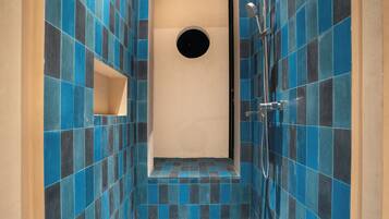 Shower, hair dryer, slippers, towels
