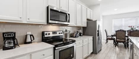 Coffee/tea maker, fridge, microwave, oven