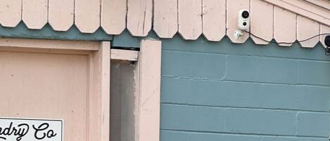 A building with a pink door and a sign that reads 'Andry Co.'