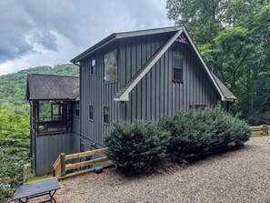 A cabin with a porch, a small deck, and a gravel driveway. - Bear Ridge-Private Cabin-Mountain Views-Hot Tub! (Blairsville)