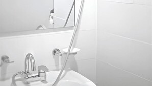 A bathroom with a white sink, a mirror, and a shower head mounted on the wall. - 4-min Walk Sinsa Station PRIVATE STUDIO #Gangnam #Central #Clinic #Treatment (Seoul)