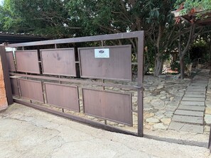 A gated entrance with a sign indicating Villa Aurea Dobarabos. - Villa Aurea House with Garden, Vico Andrea Doria Bassa 8 (Costa Rei)