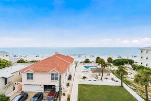 A beachfront property with a swimming pool, a tennis court, and a view of the ocean. - Top Floor Gulf Front • Pool • Sand Castle North 503 (Indian Rocks Beach)